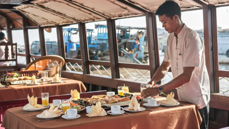 Crew preparing breakfast onboard Bassac Cruise on a luxury Mekong Delta cruise in Can Tho