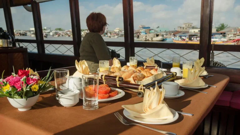 Breakfast with river view onboard Bassac Cruise during a Mekong Delta cruise in Can Tho, Vietnam