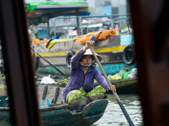 Daily life at Cai Rang Floating Market seen from a Mekong Delta cruise in Can Tho