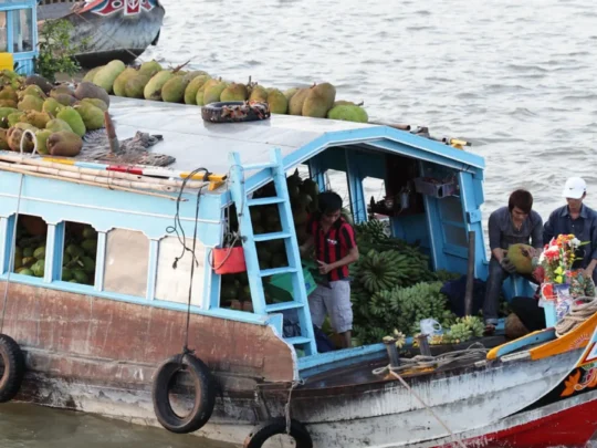 Fruit boats at Cai Rang Floating Market on the Mekong River in Can Tho