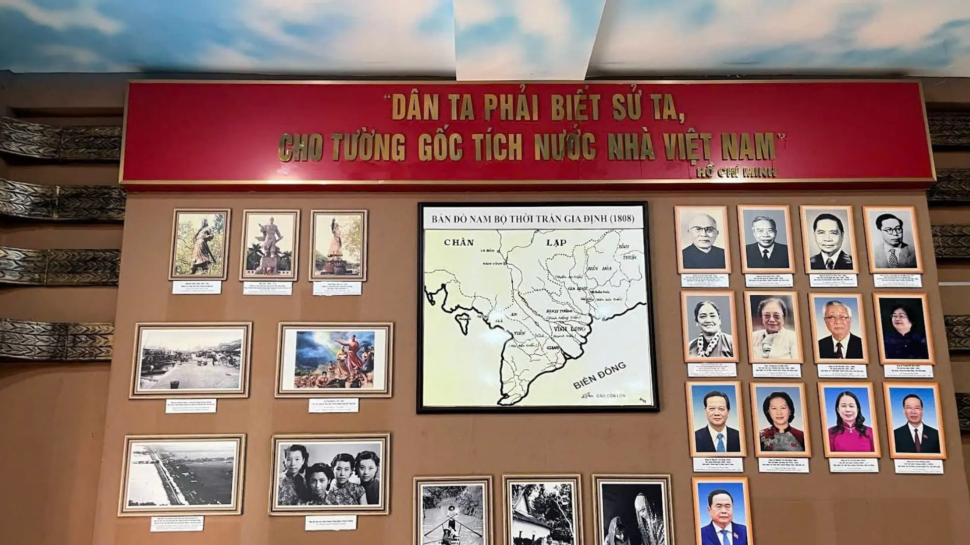 Historical gallery at Military Zone 9 Museum in Can Tho showcasing leaders, maps, and wartime photos