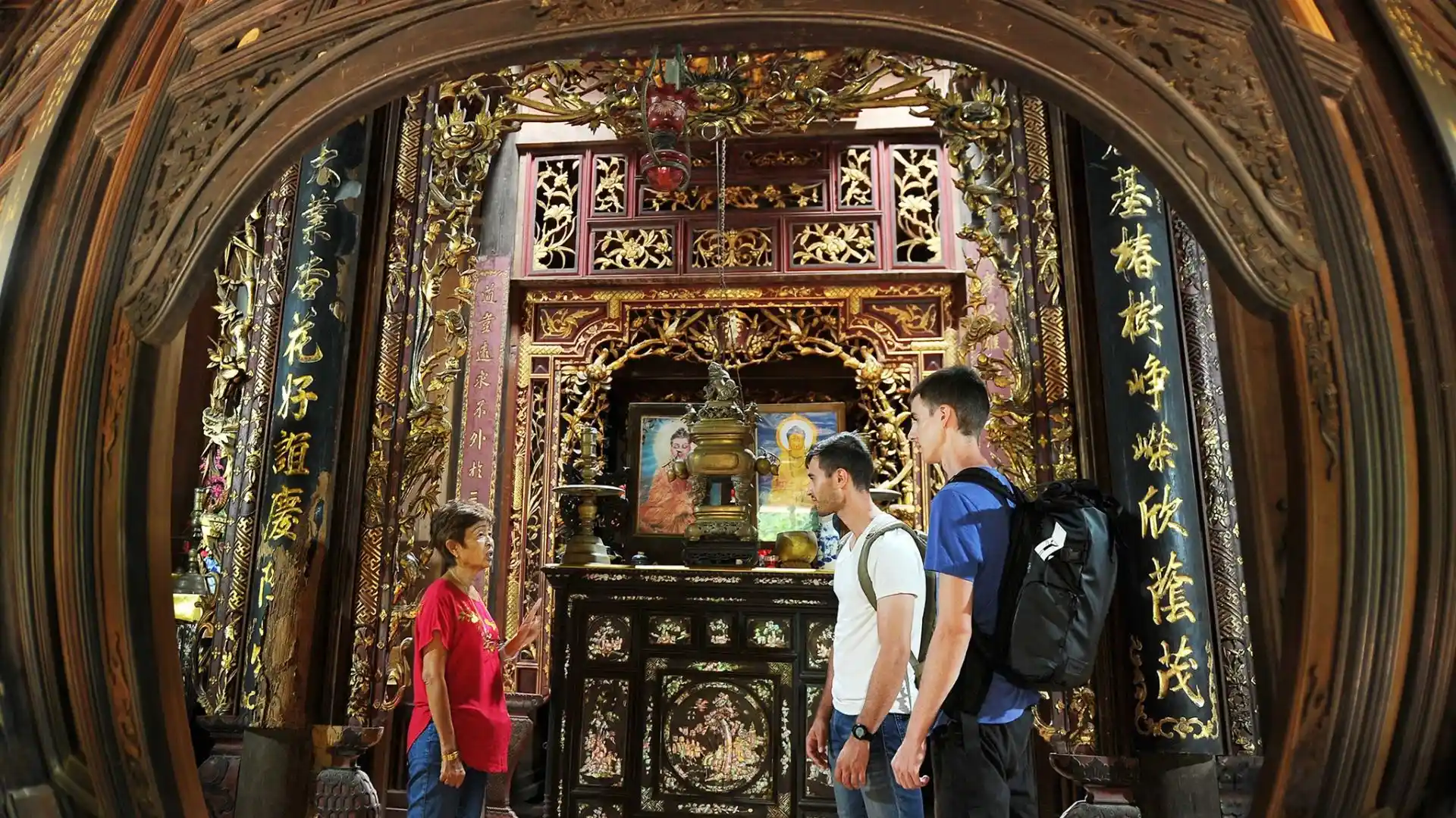 Mr Kiet Ancient House Cai Be: Vietnam’s 108 Pillar Heritage Home 154 Tourists learning about the intricate wood carvings inside the main hall of Mr Kiet Ancient House