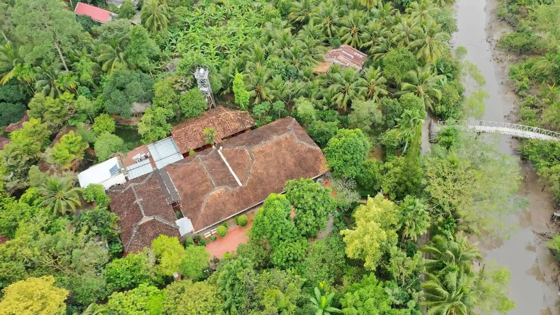 Panoramic landscape of Mr Kiet Ancient House surrounded by tropical trees