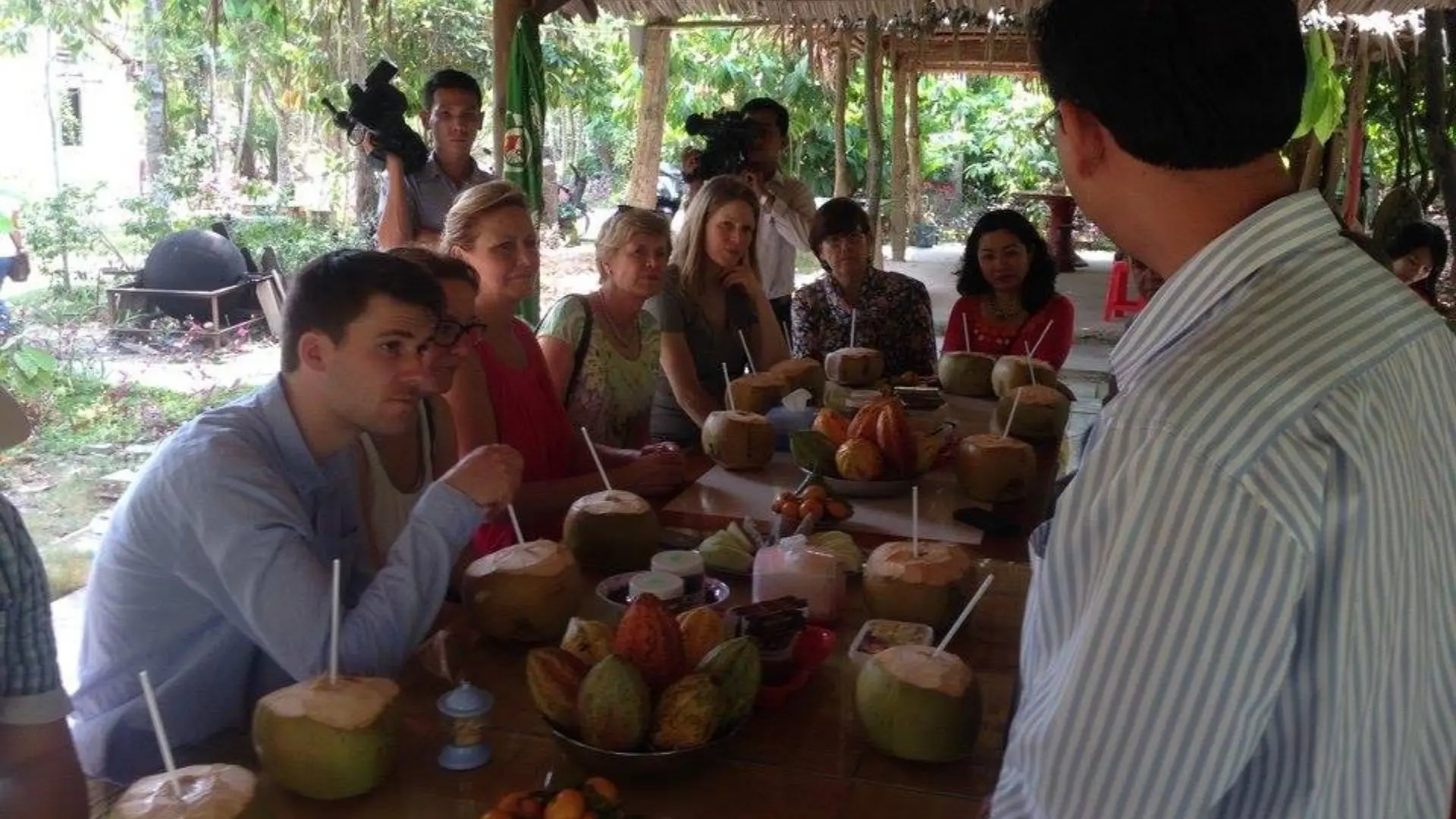 Visitors enjoying cacao products together at the garden