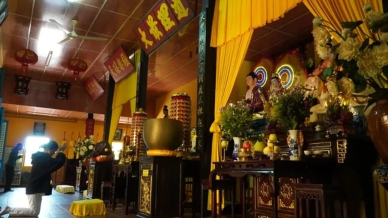 Interior main hall of Nam Nha Pagoda with multiple sacred Buddha statues