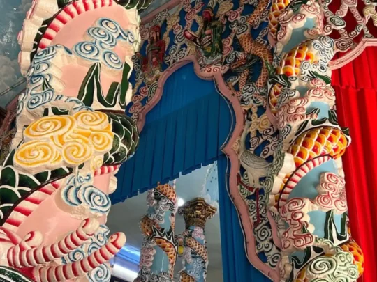 Close-up of dragon and Buddhist decorations at Ba Den Mountain temple, Tay Ninh