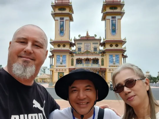 Visitors posing at Ba Den Mountain temple, Tay Ninh, Vietnam