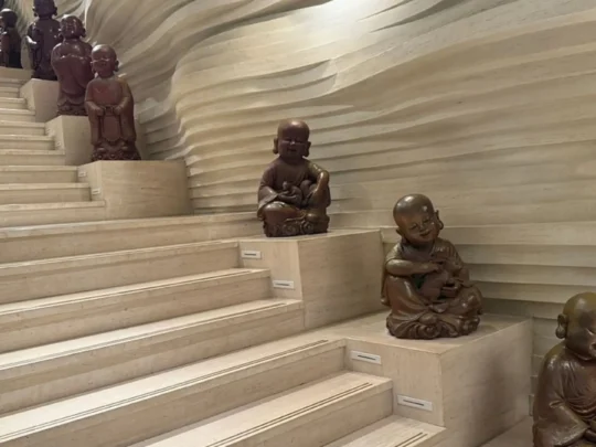 Buddha statues lining temple stairs at Ba Den Mountain, Tay Ninh