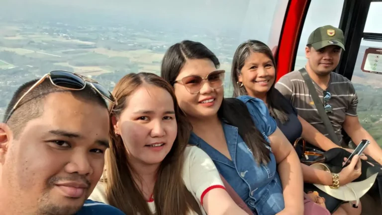 Tourists taking group selfies at Ba Den Mountain, Tay Ninh, Vietnam