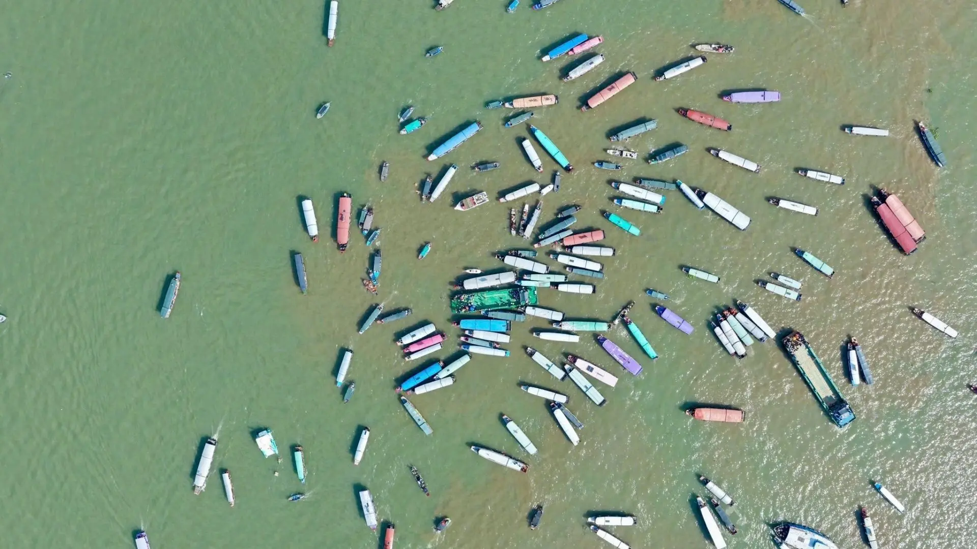 Aerial view of numerous boats assembling on the river during Tong Phong Festival in Can Tho