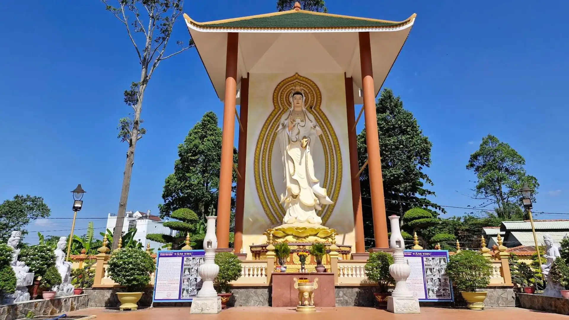 Avalokiteshvara statue in the courtyard of Vinh Trang Pagoda, a spiritual site in Tien Giang