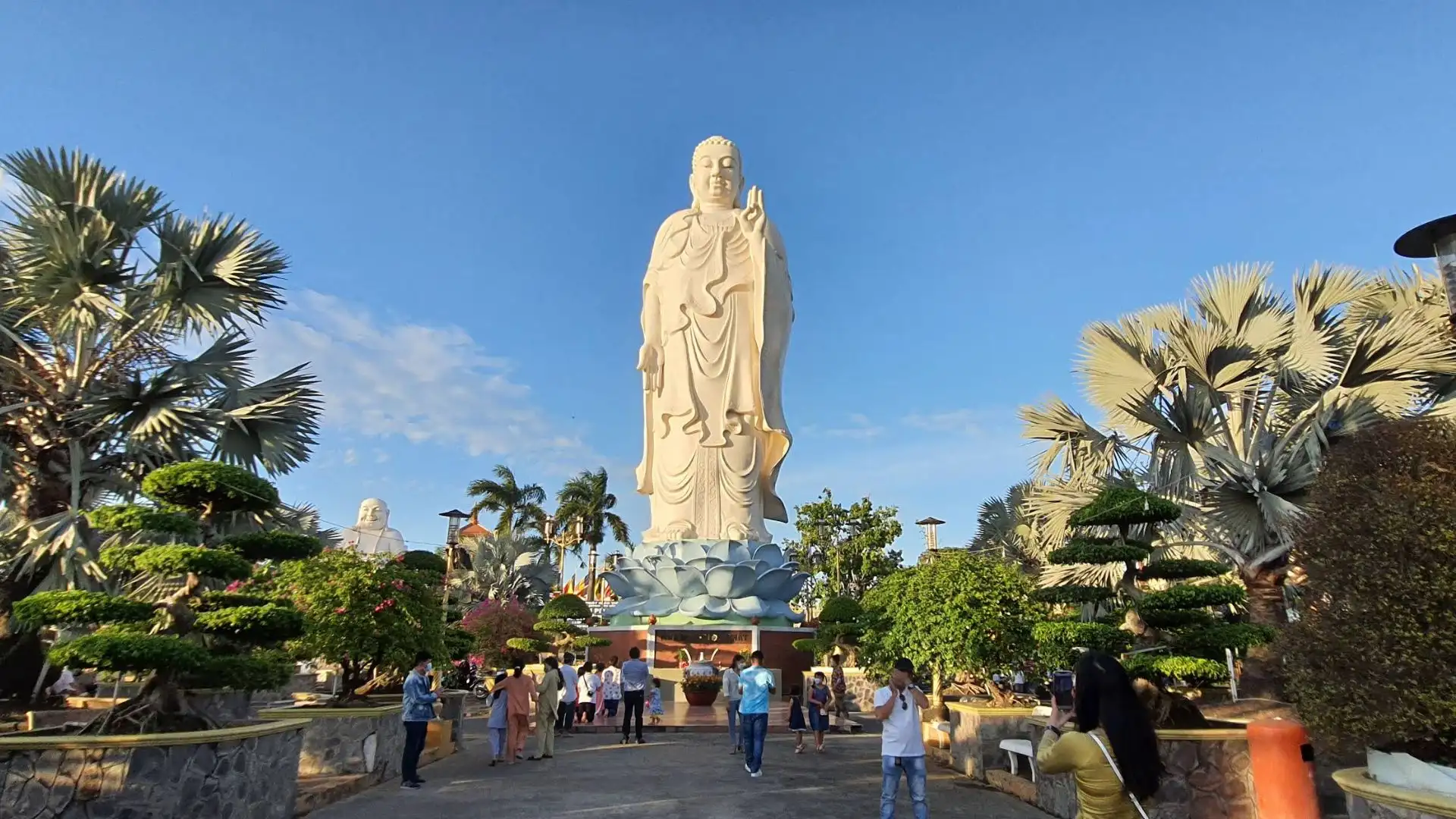 Large Amitabha Buddha statue in the garden of Vinh Trang Pagoda, My Tho, Tien Giang