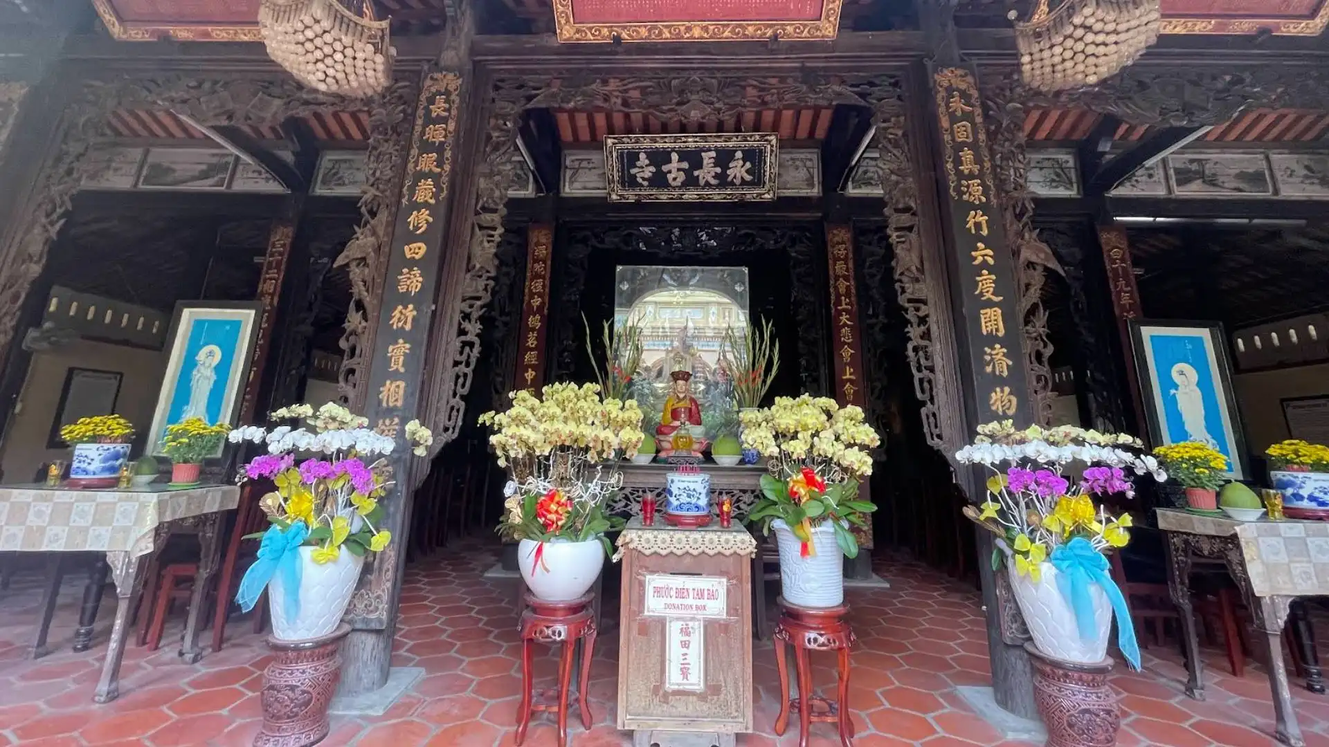 Interior altar of the main hall at Vinh Trang Pagoda in My Tho, Tien Giang, Vietnam