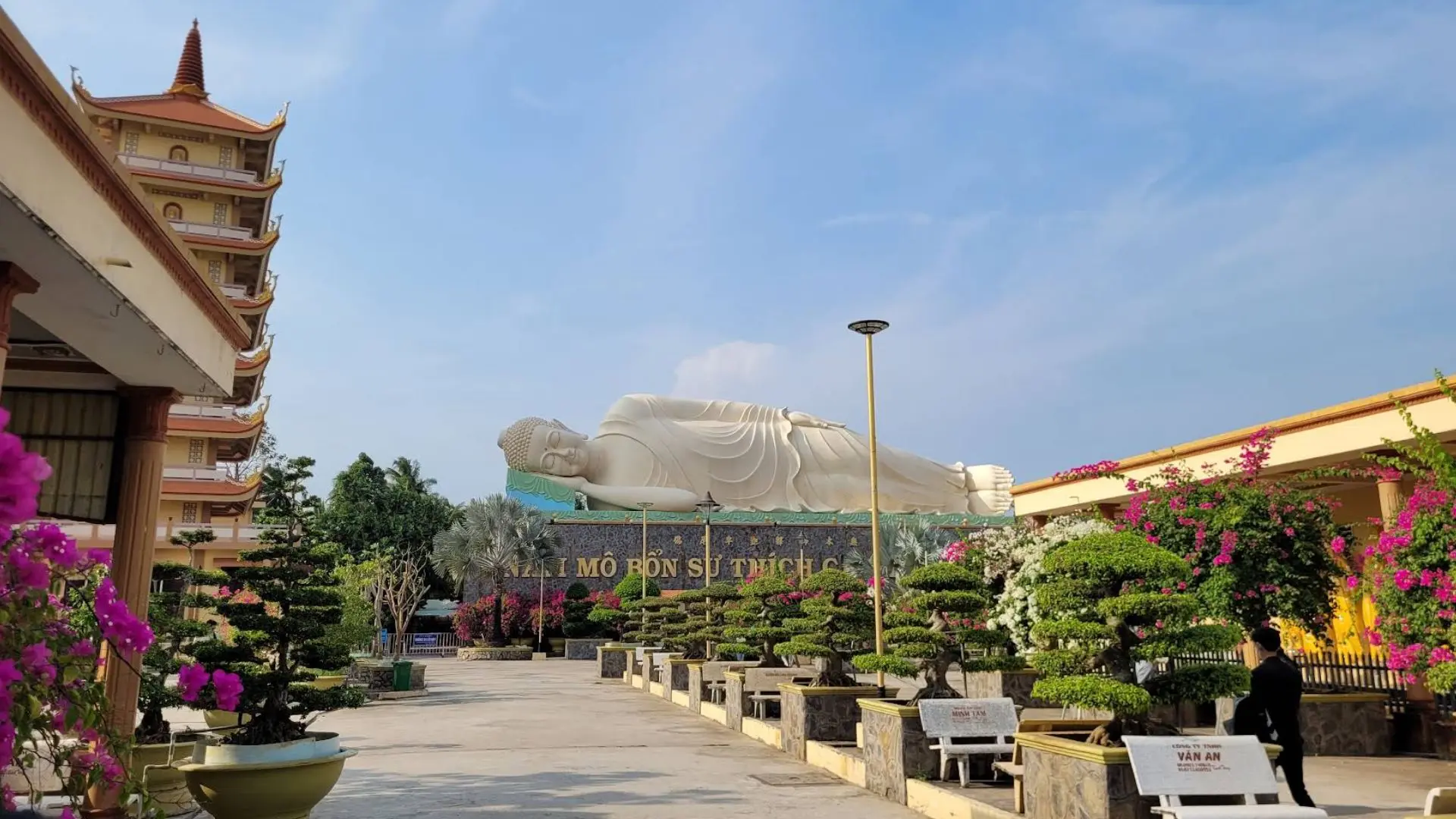 Temple walkway toward the reclining Buddha at Vinh Trang Pagoda, Tien Giang