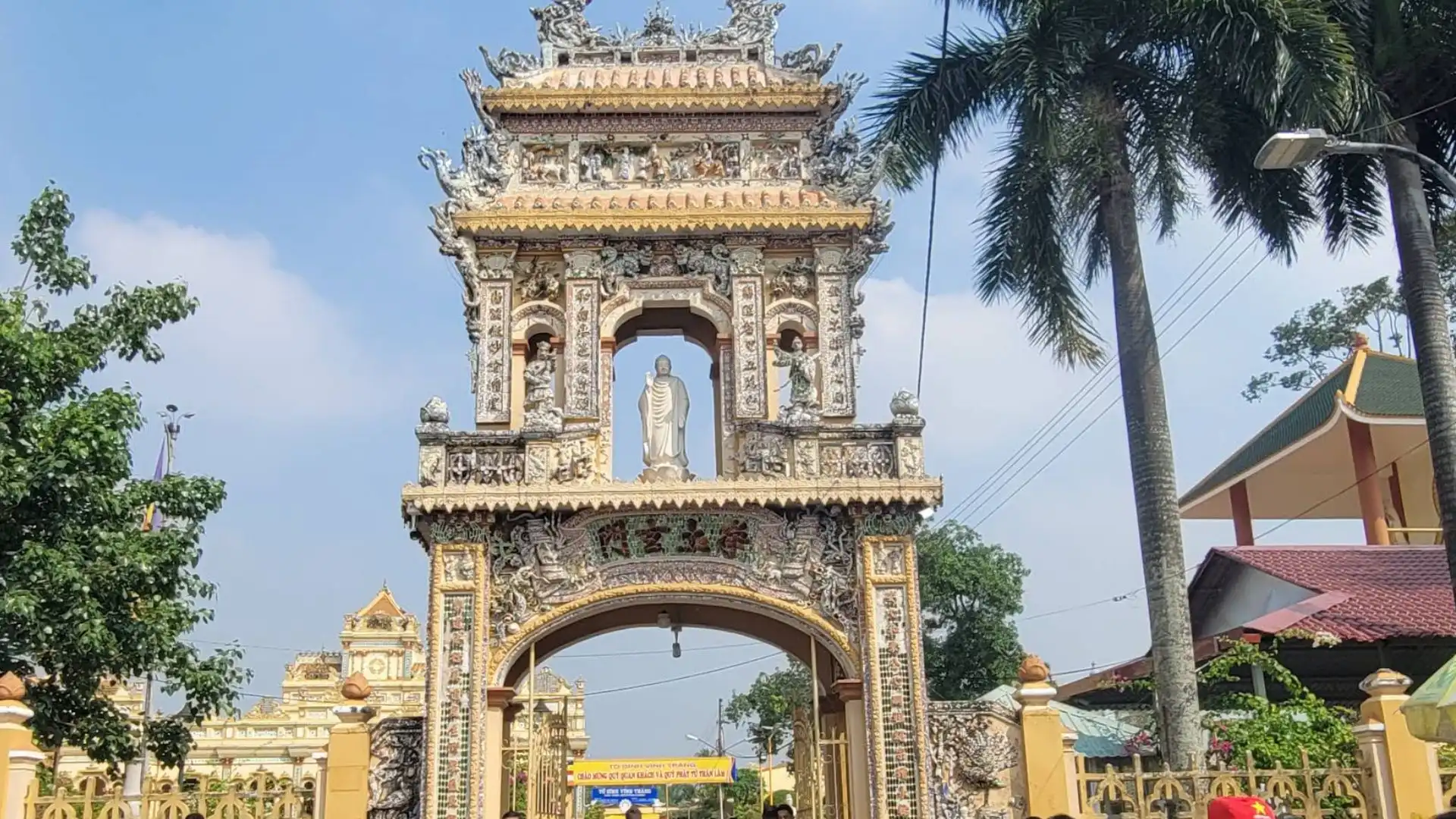 Decorative triple gate entrance of Vinh Trang Pagoda in My Tho, Tien Giang, Vietnam