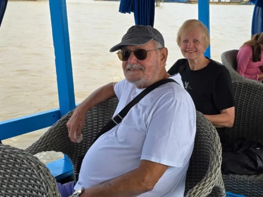 Motorized boat cruising along the Tien River during Authentic My Tho Mekong Delta Tour