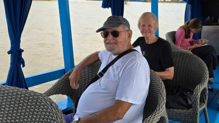 Motorized boat cruising along the Tien River during Authentic My Tho Mekong Delta Tour