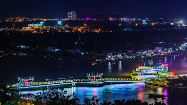 Illuminated Ninh Kieu Pedestrian Bridge along the Can Tho waterfront at night