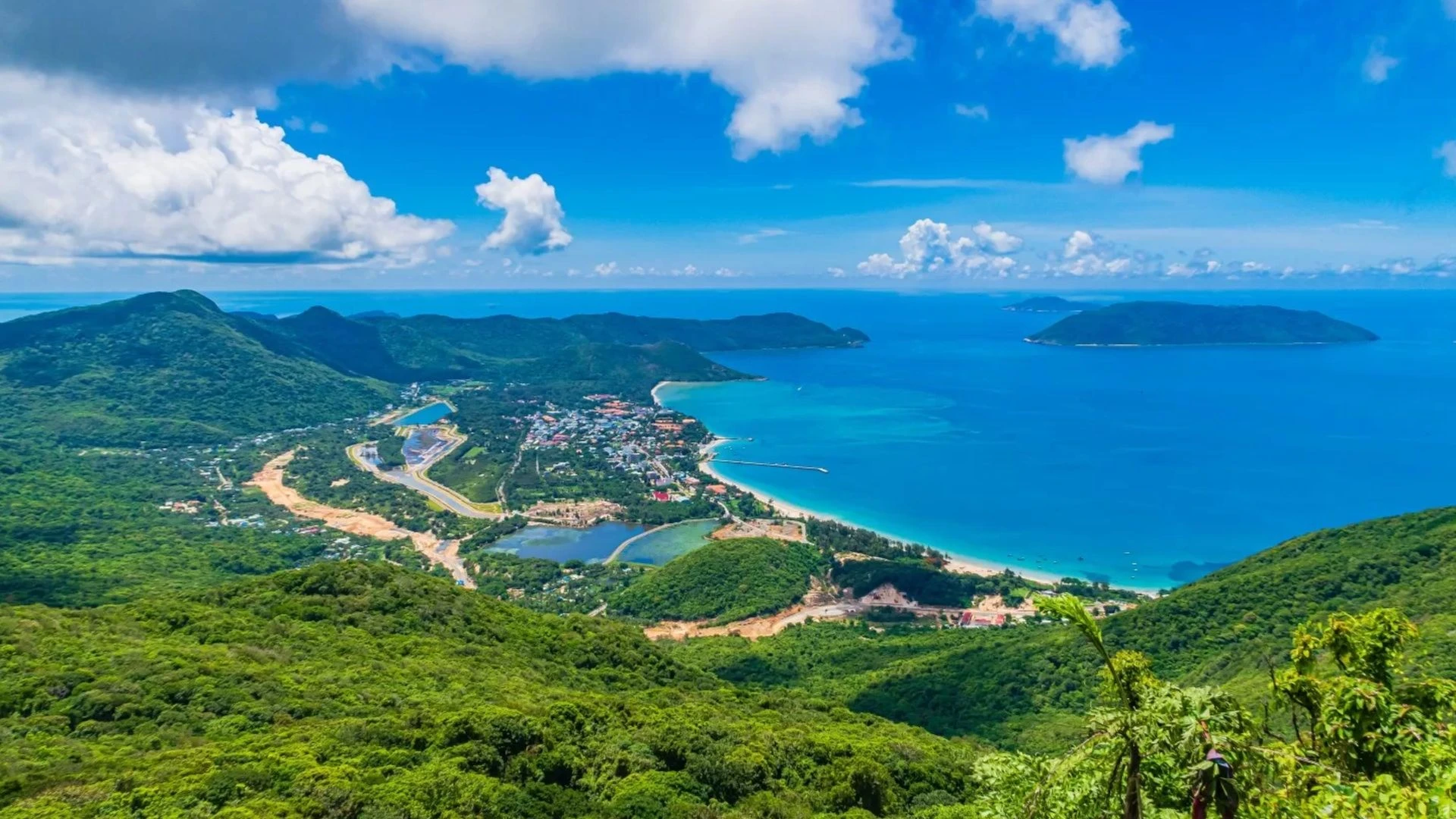 Panoramic Con Dao National Park view during Ong Cau Beach tour with forest mountains and blue coastline