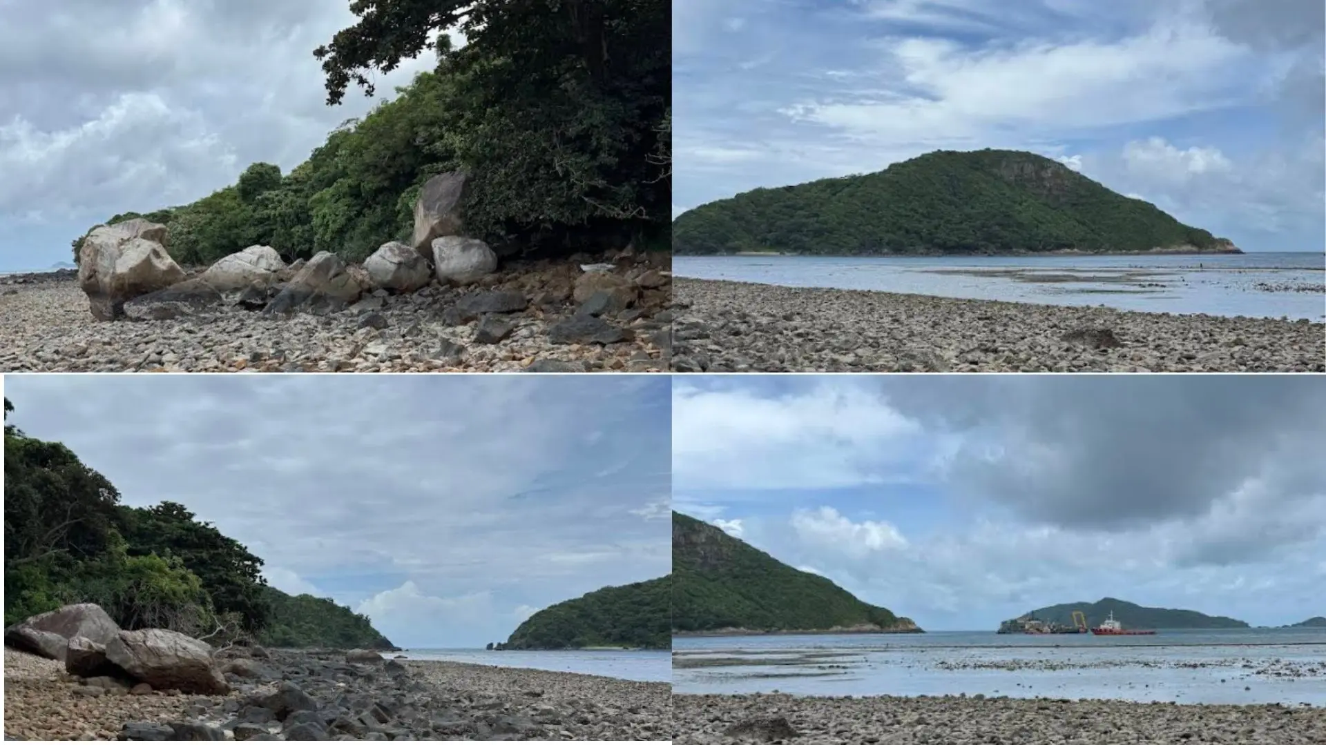 Panoramic view of Ong Cau Beach in Con Dao with rocky shore, calm ocean, and surrounding green mountains