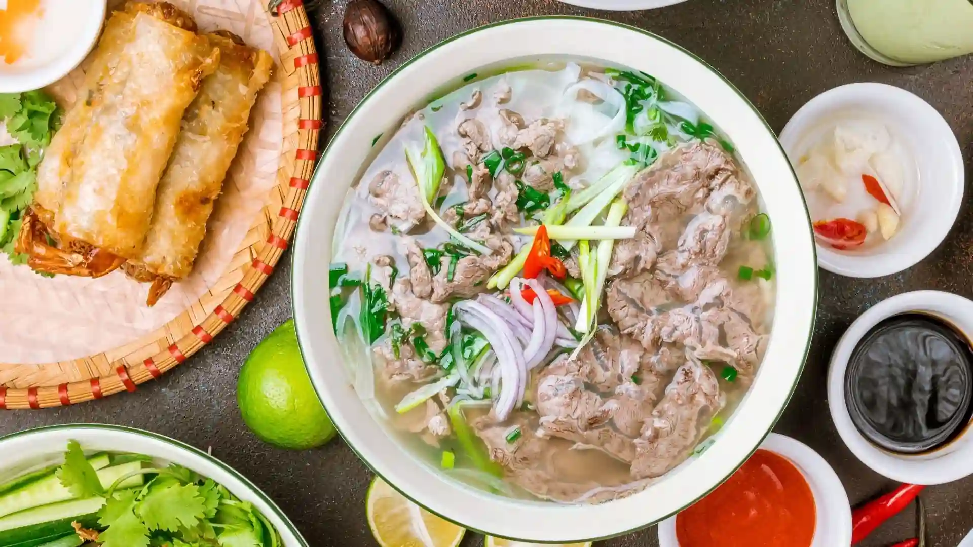 What to Eat in Vietnam: 30 Must-Try Dishes 79 Bowl of Vietnamese beef phở with rice noodles, beef and herbs
