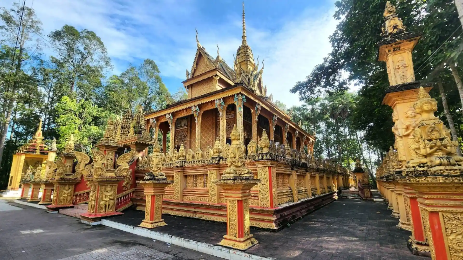 Phu Ly Pagoda: Discover the Khmer Heritage of Phu Ly 1 7 Golden main sanctuary of Phu Ly Pagoda in Vinh Long with elaborate Khmer roof decorations