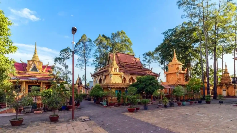 Courtyard and traditional Khmer temple buildings at Pothisomron Pagoda in O Mon, Can Tho
