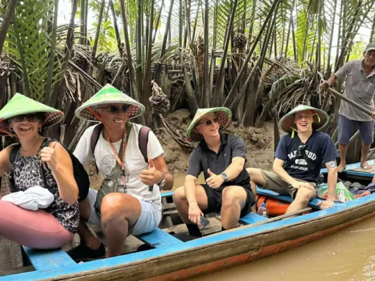 Small sampan boat ride through shaded canals in the Mekong Delta