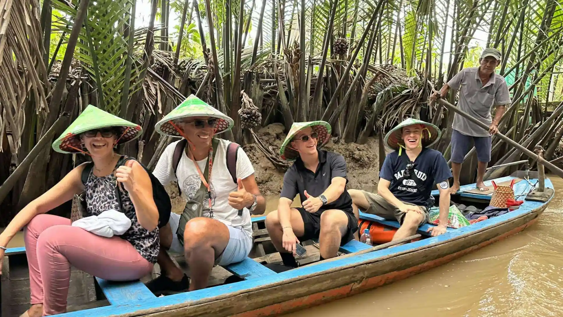 Small sampan boat ride through shaded canals in the Mekong Delta