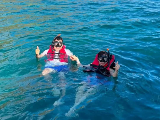 Two snorkelers floating on the water at Bamboo Lagoon in Con Dao