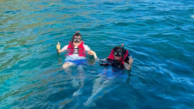 Two snorkelers floating on the water at Bamboo Lagoon in Con Dao