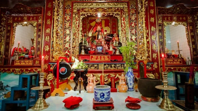 The traditional interior design of Binh Thuy Ancient Temple, showcasing intricate carvings and Vietnamese cultural heritage.