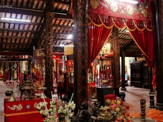 A quiet and sacred worship area inside the temple, decorated with offerings and traditional elements.