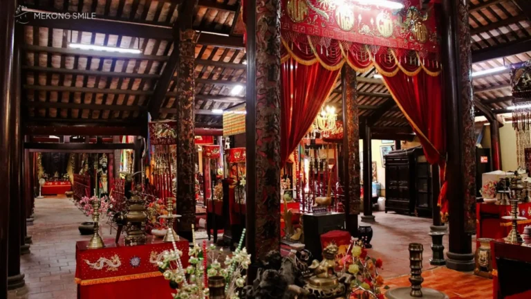 A quiet and sacred worship area inside the temple, decorated with offerings and traditional elements.