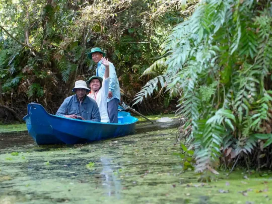 The enthusiastic expression of a local guide, showing their love for the forest and the tour
