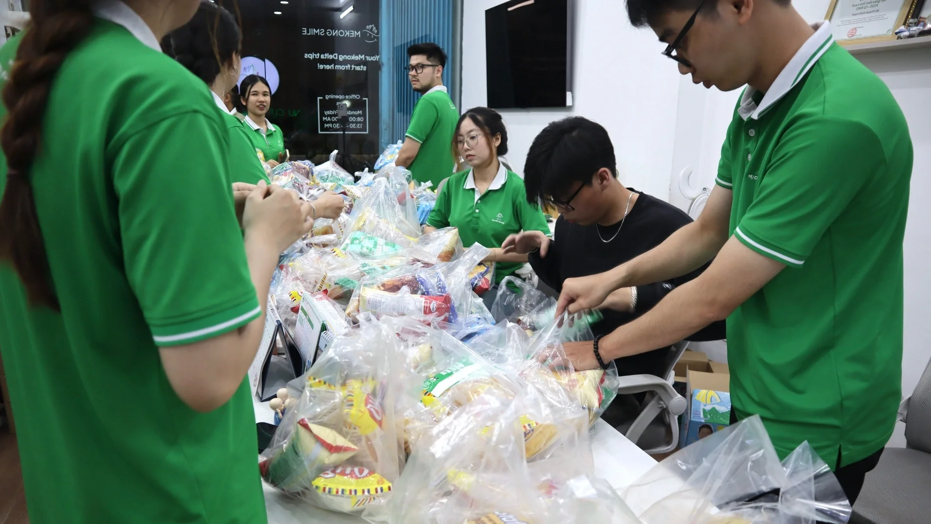 Sowing Smiles: A Community Charity Series by Mekong Smile 9 Sowing Smiles volunteers preparing snacks and gifts for charity