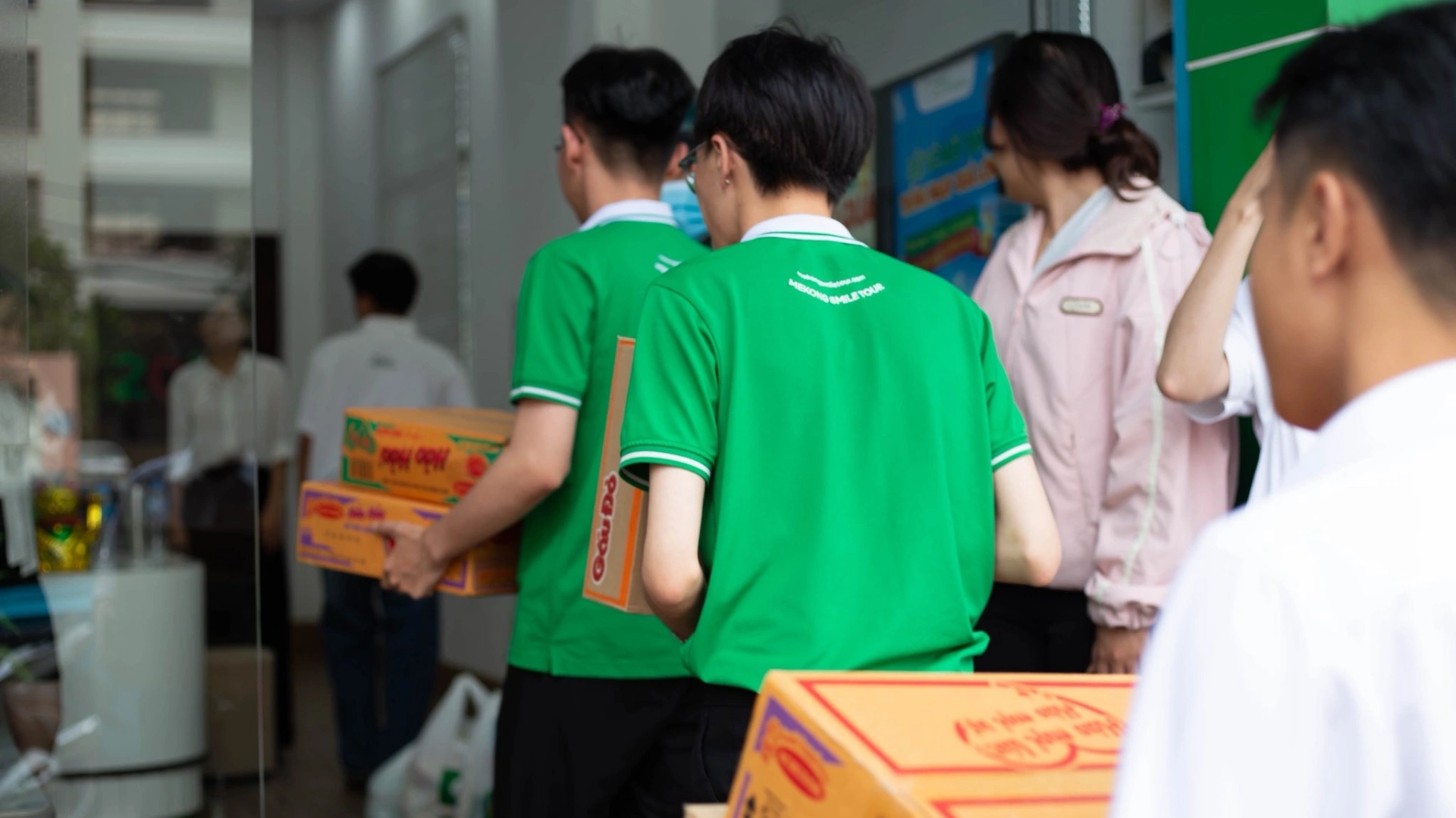 Sowing Smiles team members carrying supplies for community support