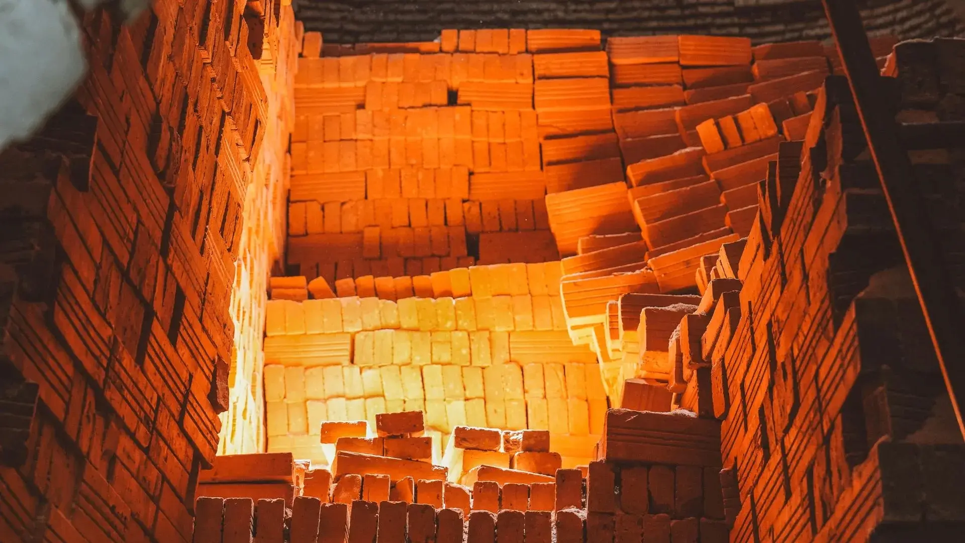 Bricks stacked inside a traditional kiln in Ben Tre