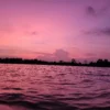Watching the sunset from boat on the river