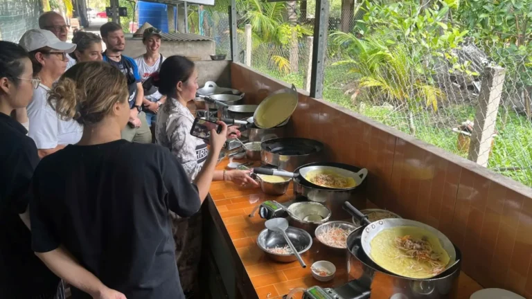 Sustainable Tourism experience cooking Vietnamese banh xeo with locals