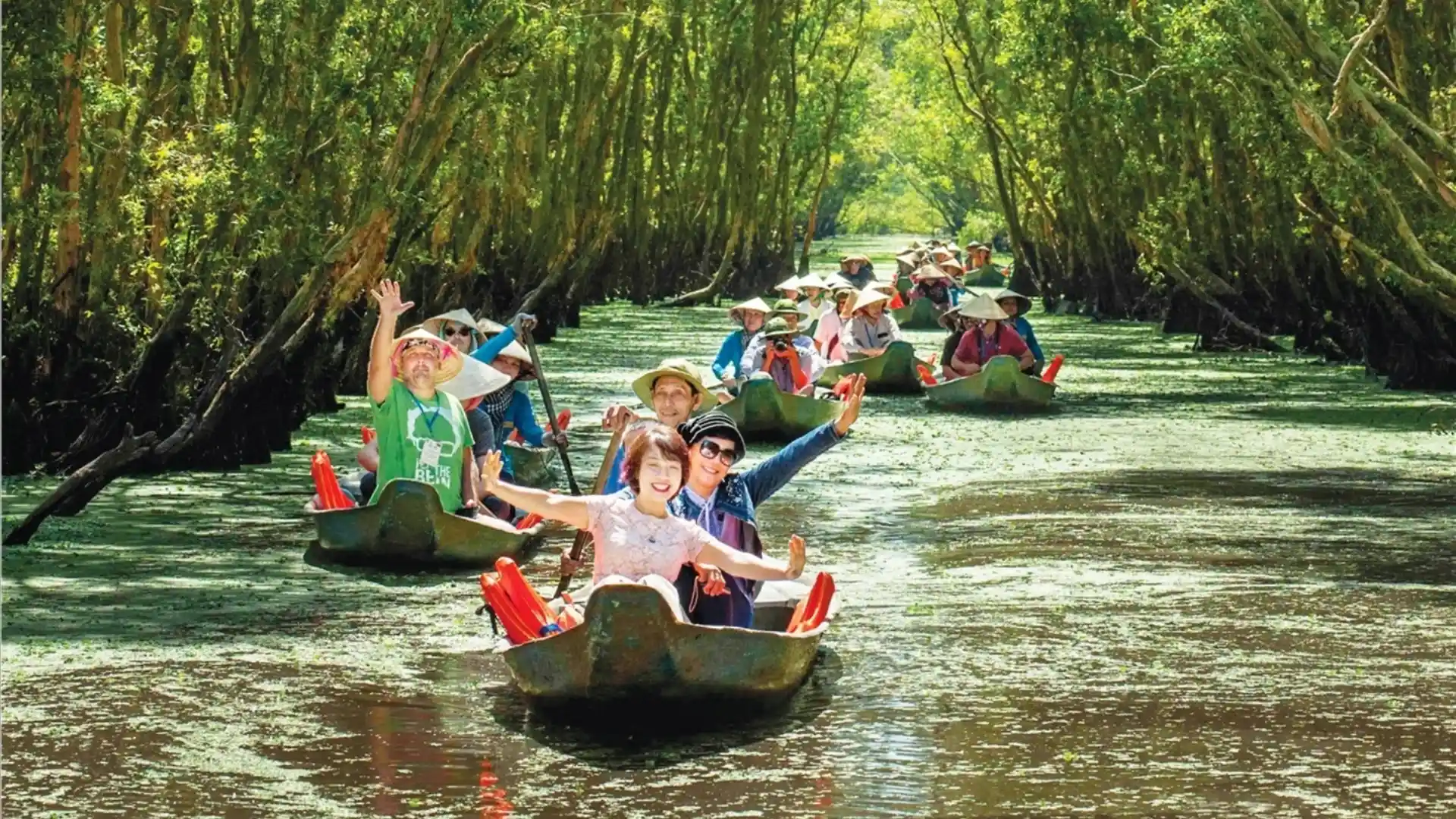 Mekong Smile’s Sustainable Tourism Mission Statement 7 Tourists enjoying Sustainable Tourism by rowing traditional boat in Mekong Delta