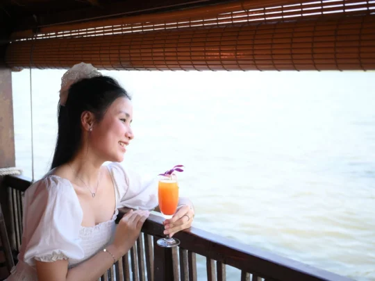 Tourists taking photos along the Mekong River – Can Tho Sunset Tour with Mekong Smile