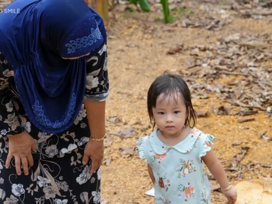 An adorable Cham baby, offering a glimpse into the local community and daily life