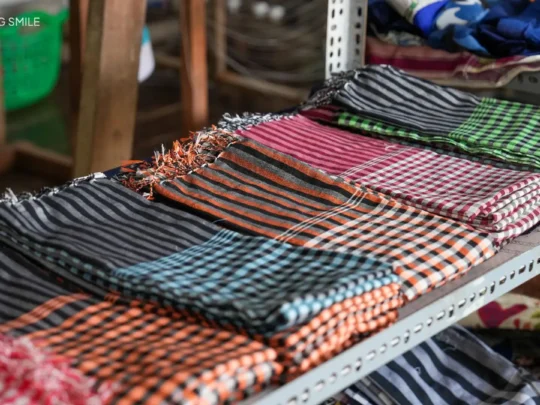 A close-up of a traditional Cham checkered scarf, a staple of their clothing