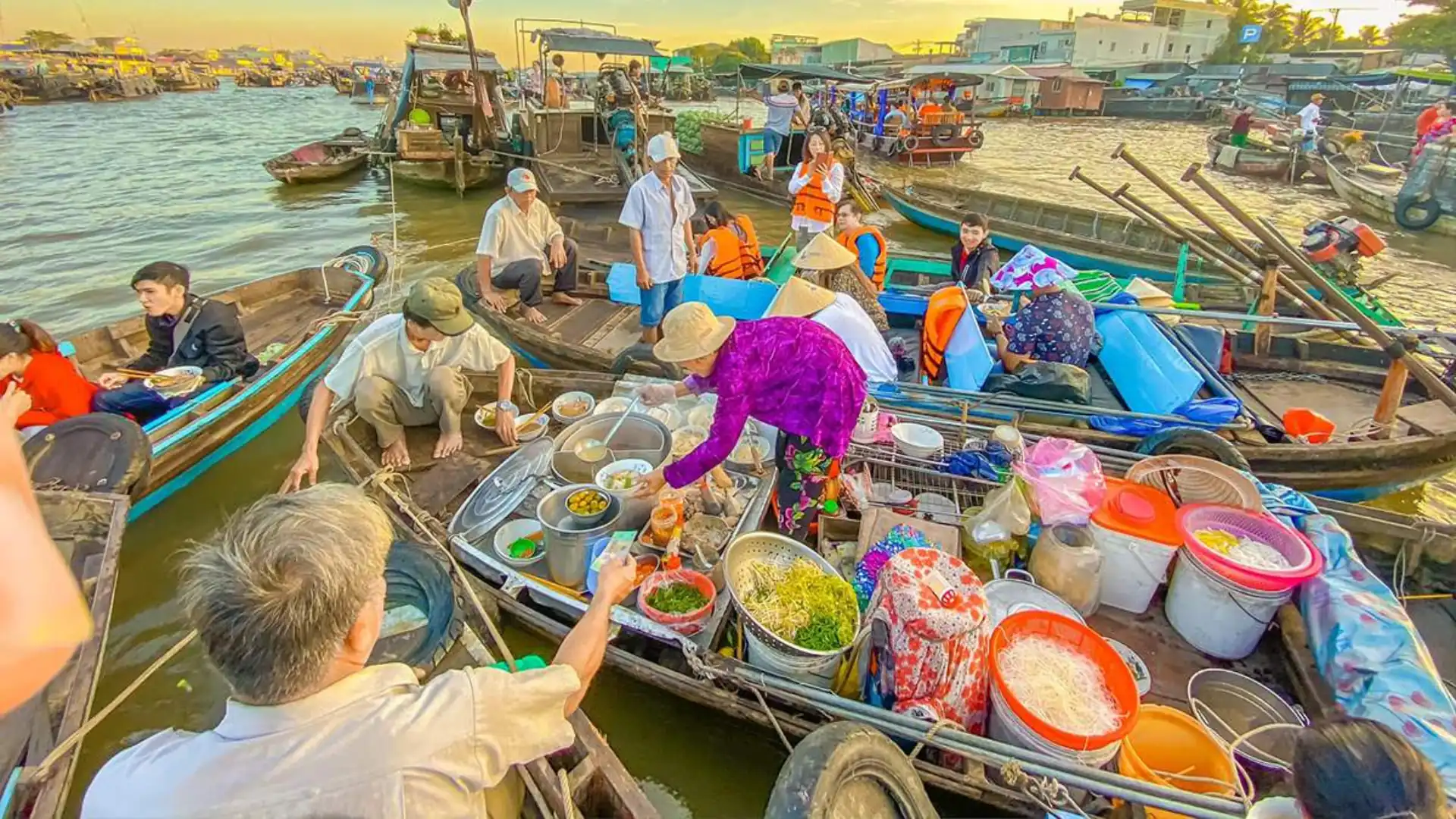 Witness a lively trading scene where culture and commerce flow together at Cai Rang Floating Market