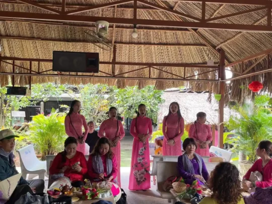Traditional Đờn ca tài tử folk music performance with tropical fruits on My Tho day tour