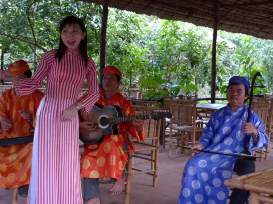 Enjoying traditional Vietnamese folk music performance in the Mekong Delta