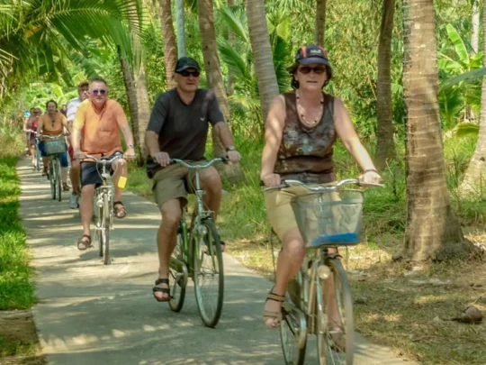 Cycling through peaceful village roads in Ben Tre Vietnam