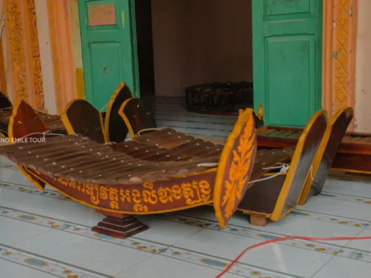 A traditional Khmer musical instrument on display at a cultural site during the Vinh Long tour.