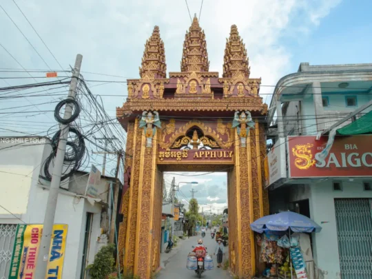 The ornate and colorful entrance gate to the historic Phu Ly Pagoda in Vinh Long